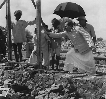 Meher Baba Overseeing Construction Work